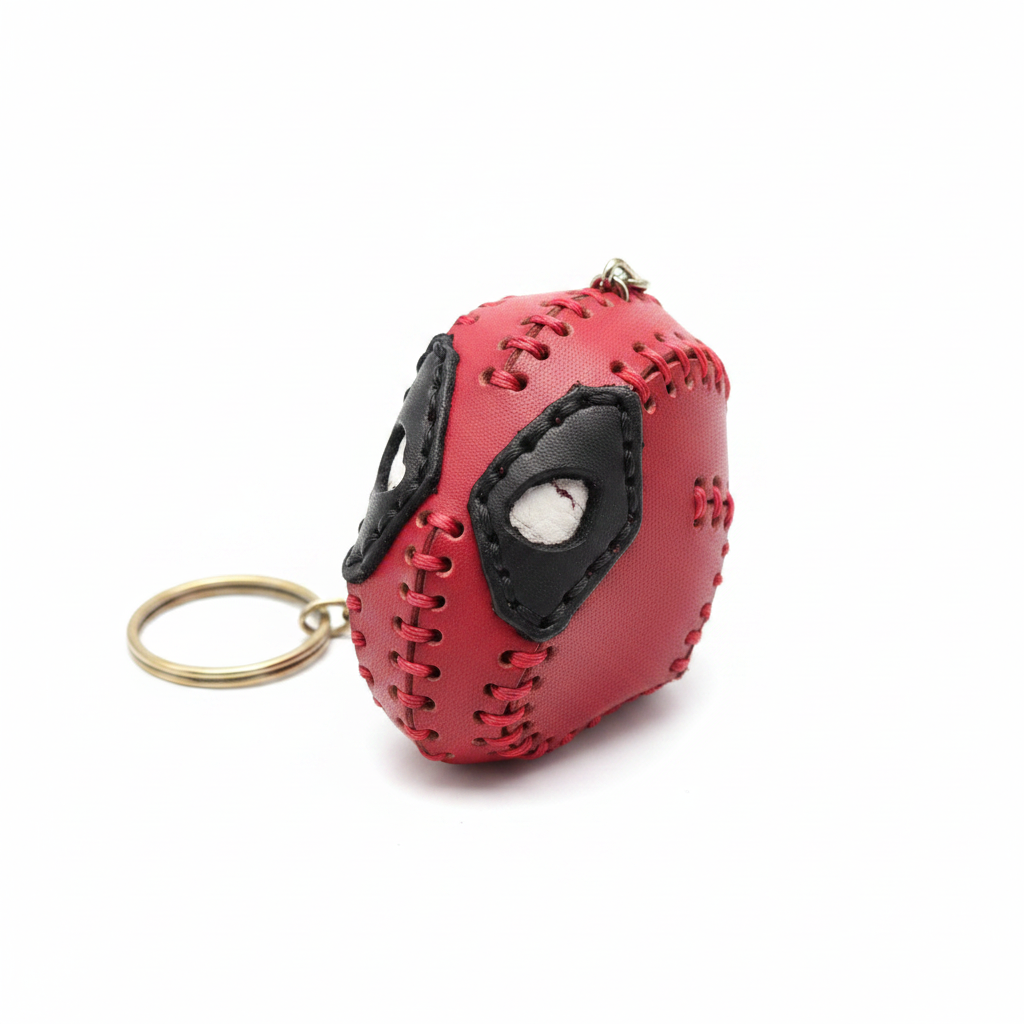 Handcrafted leather Deadpool head keyring on white background