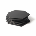 Stack of black hexagonal leather coasters on white background