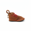 Handcrafted tan leather boot keyring with red laces - side view on white background